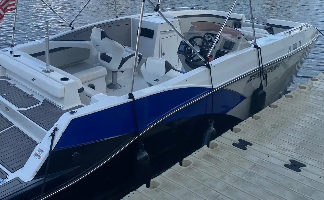 Helm, captain's chairs and bow seating on a deck boat in Cape Coral, FL