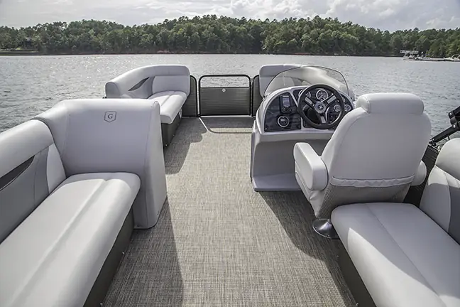 Lounge seating and helm on a pontoon boat for rent in Cape Coral, FL